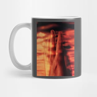 Digital collage and special processing. Hand near soft light. Soft and calm. To exist. Orange and warm. Mug